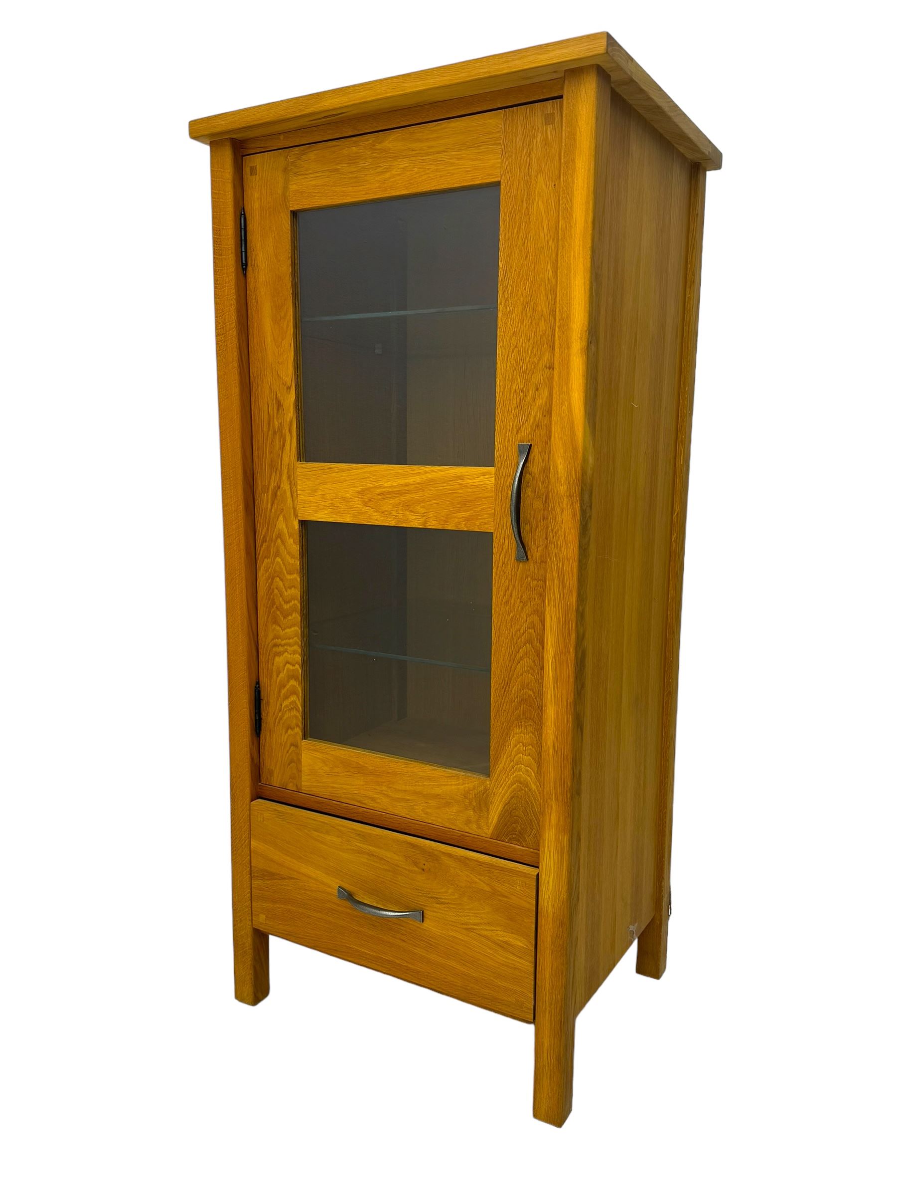 Laura Ashley - contemporary Milton oak display cabinet, featuring single door with two glass panels and pewter effect handle, enclosing one fixed oak shelf and two adjustable glass shelves, access hole at the bottom shelf, over single drawer with matching handle, on square legs