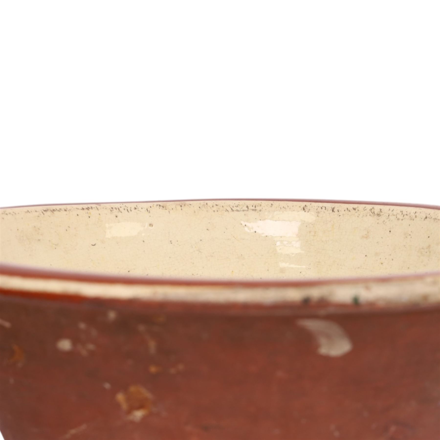 19th century pancheon, of tapering circular form, the glazed interior with slip decoration H20cm, D42cm 