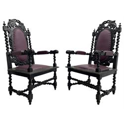 Pair of Victorian Carolean design open armchairs, the cresting rail pierced and carved with foliage over trailing grape vine and spiral turned supports, oval back, seat and arms upholstered in purple leather with stud work, acanthus carved arm terminals on spiral pillars, the seat rail carved with lunettes and foliate decoration, on turned and block supports carved with flower heads united by spiral turned stretchers