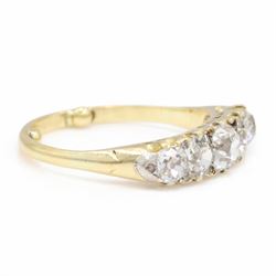 Early 20th century 18ct gold diamond ring, set with five graduating old cut diamonds and diamond accents, total diamond weight approx 1.55 carat
