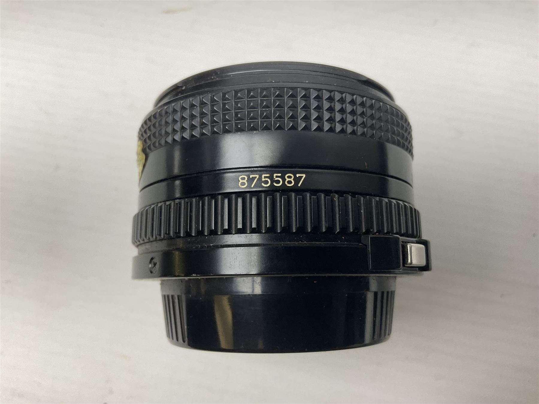 Canon A1 35mm camera body serial no 741264, with 'Tokina AT-X 28-85mm 1:3.5-4.5' lens serial no 821679, 'Canon FD 50mm 1:1.8mm' lens and other camera equipment 