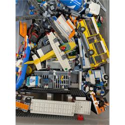 Large collection of Lego, including partially built vehicles, Police Station, Lego Creator 31010 and a collection of Lego instruction booklets