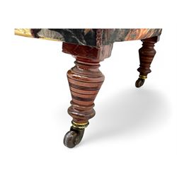 Victorian hardwood-framed chaise longue, serpentine back with rolled arm, upholstered in floral pattern fabric, on ring turned legs with ceramic castors 