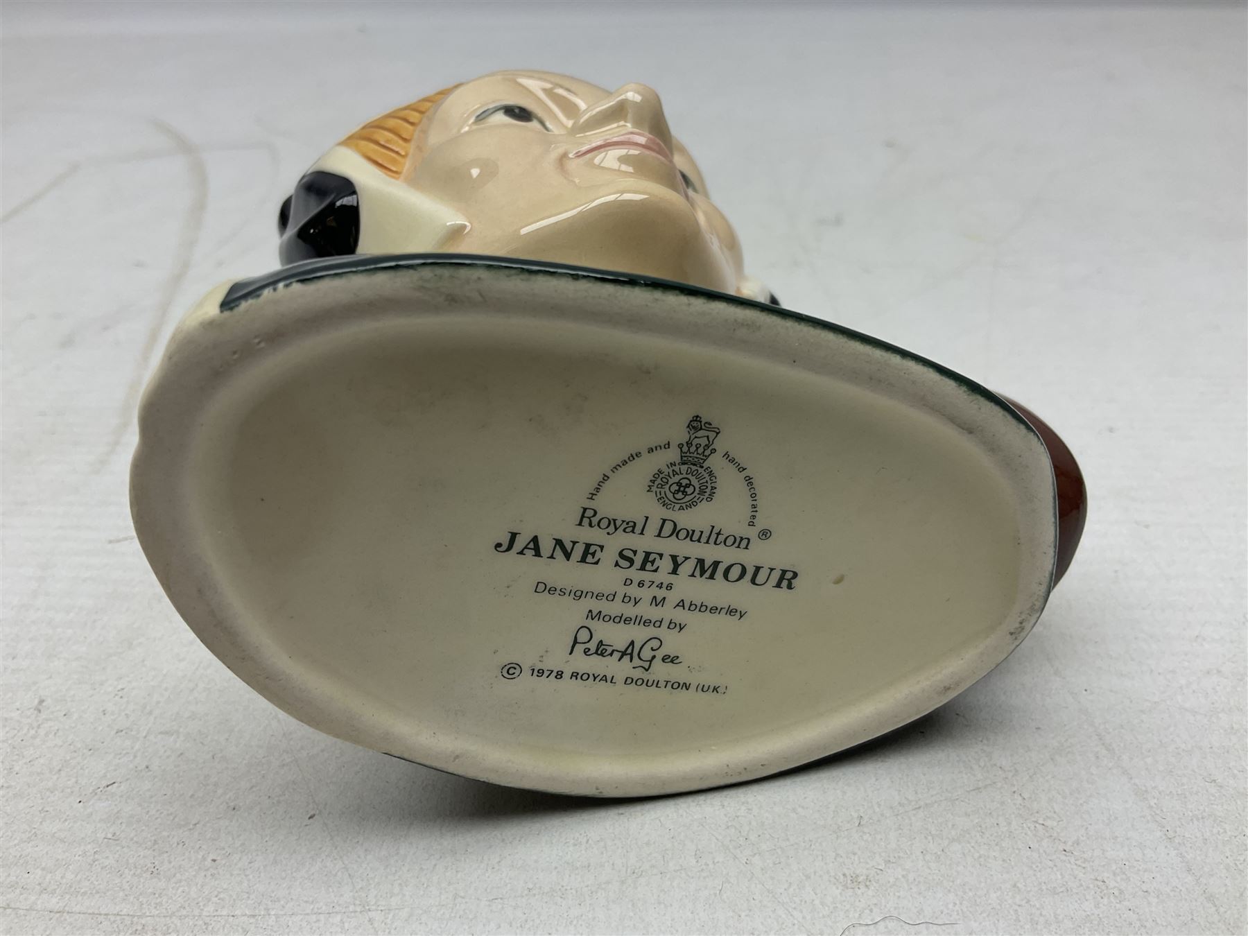 Royal Doulton Henry VIII and his Six Wives Character Jugs, comprising of Henry VIII D6647, Catherine of Aragon D6657, Anne Boleyn D6650, Jane Seymour D6746, Anne of Cleves D6753, Catherine Howard D6692 and Catherine Parr D6751, tallest H10cm