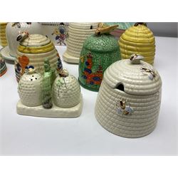 Clarice Cliff for Wilkinson Ltd Crocus Bizarre beehive honeypot painted in the Crocus pattern, together with two beehive Beswick honey pots, Poole square honey pot etc (14)