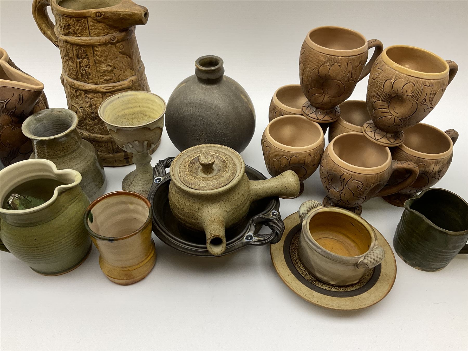 Studio pottery, to include Borgh pottery twin handled bowl, Hillstonia naturalistically modelled jug, set of seven mugs, jug and two vases.