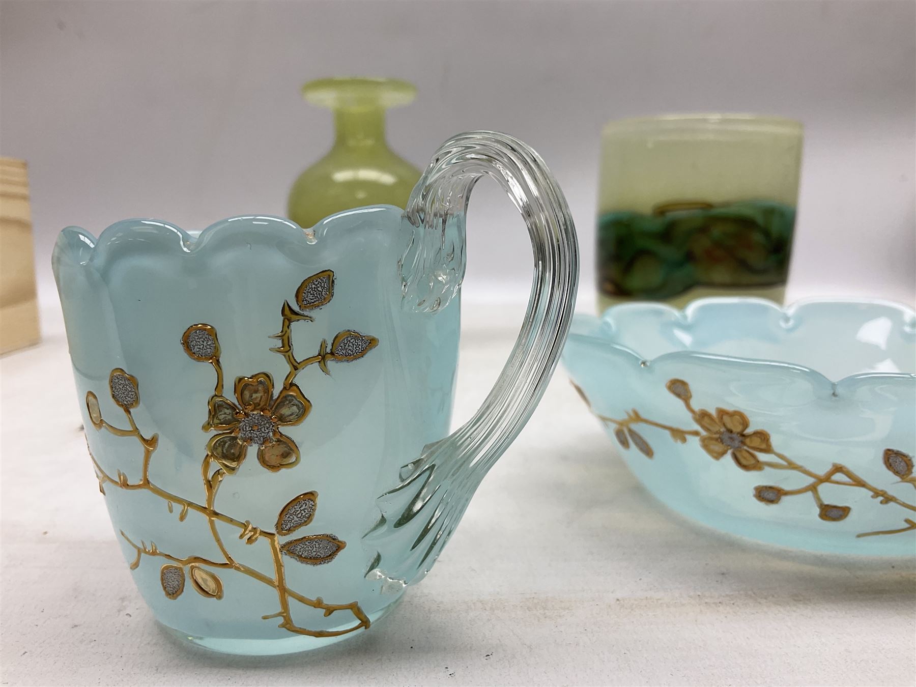 Mdina sea and sand glass vase, of cylindrical form, decorated in green, turquoise and brown, and matching vase, both unmarked together with a glass bowl and jug with gilt decoration 