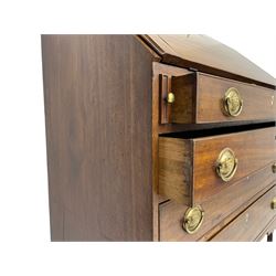 George III mahogany bureau, the fall-front banded and with boxwood stringing, enclosing fitted interior with pigeonholes and drawers surrounding a central cupboard with inlaid shell motif, the base with four graduating cock-beaded drawers, each with pressed brass handle plates with central lion masks and ivory escutcheons, on shaped bracket feet
This item has been registered for sale under Section 10 of the APHA Ivory Act