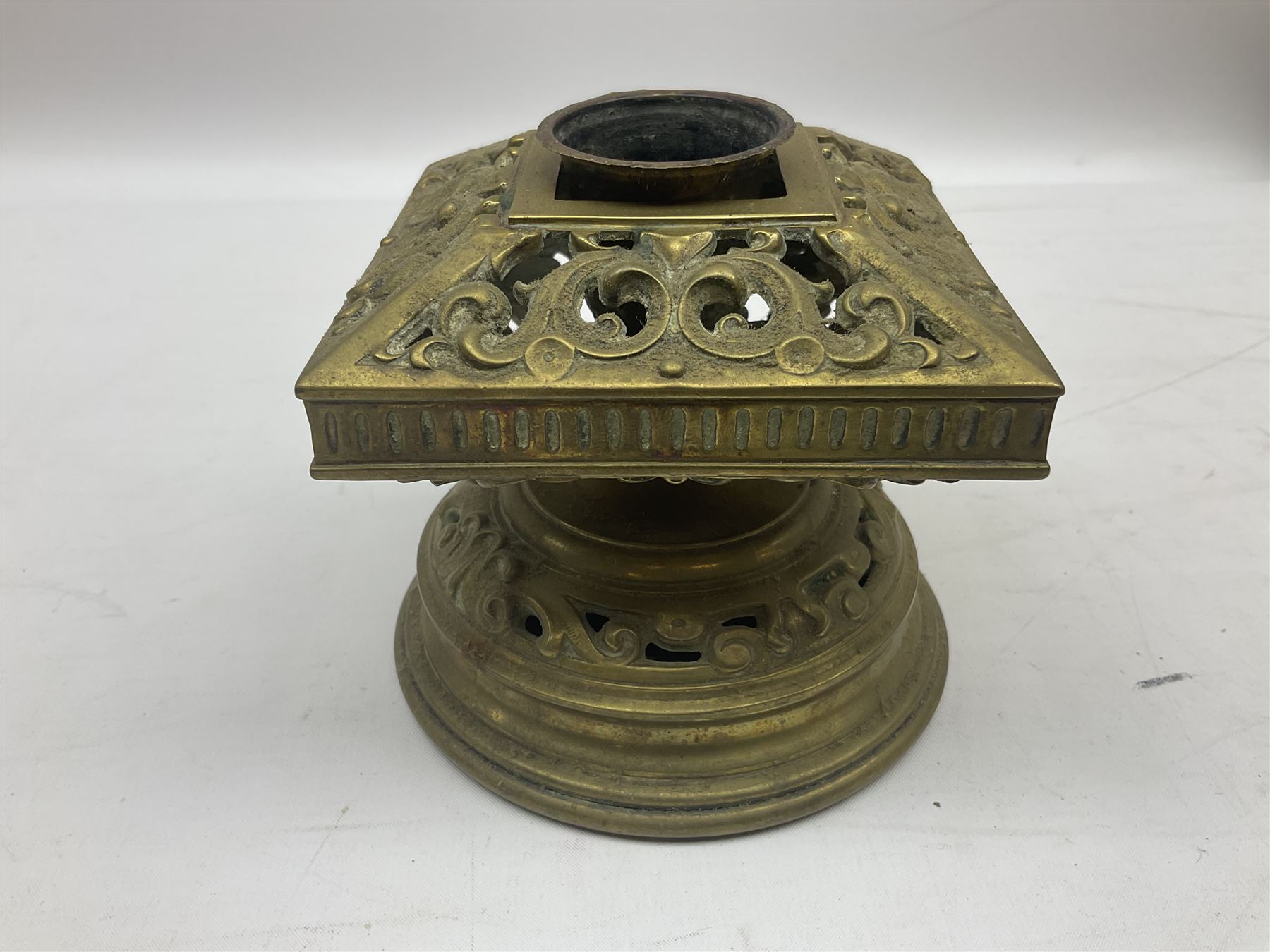 Collection of victorian and later brass desk accessories, to include a letter holder with cherub design, ink well of square form with hinged lid, brass table bell, brass casket with relief decoration, etc  