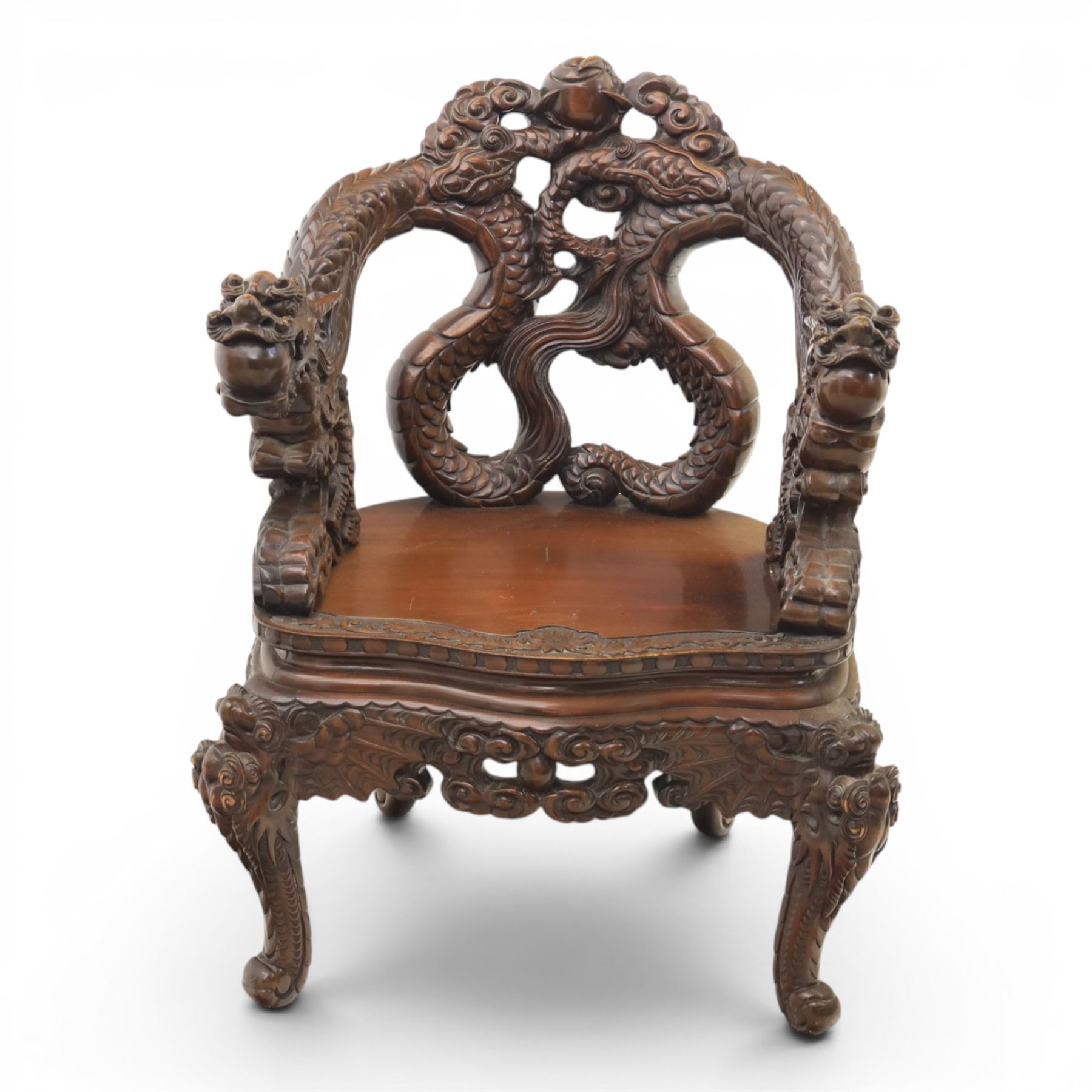 Chinese carved hardwood dragon throne chair, the shaped and pierced back with entwined dragons and cloud motifs, sweeping dragon-form arms terminating in carved heads, solid panel seat over foliate carved apron, on four mask carved cabriole supports