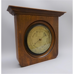  Edwardian Aneroid barometer, circular silvered dial marked F.J.Gould Optician 50 Cherry St.Birmingham, 23cm diam in oak frame with moulded cornice, H35cm, W42cm  