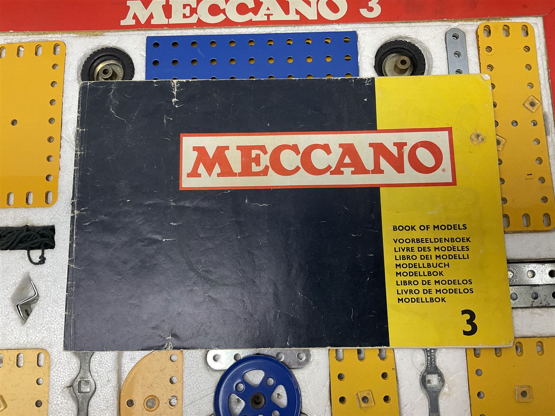 Meccano - Outfits 2, 3 & 4 with blue and yellow parts; look to be virtually complete with most apertures filled; together with a partially stocked Meccano Elekrikit; all boxed with instruction manuals (4)