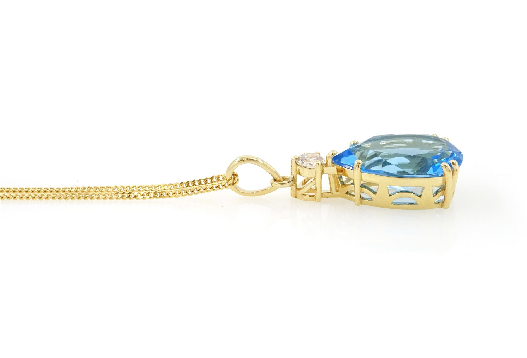 18ct gold blue topaz and diamond pendant necklace, single pear cut Swiss blue topaz of approx 6.60 carat, suspending from a single round brilliant cut diamond of approx 0.15 carat