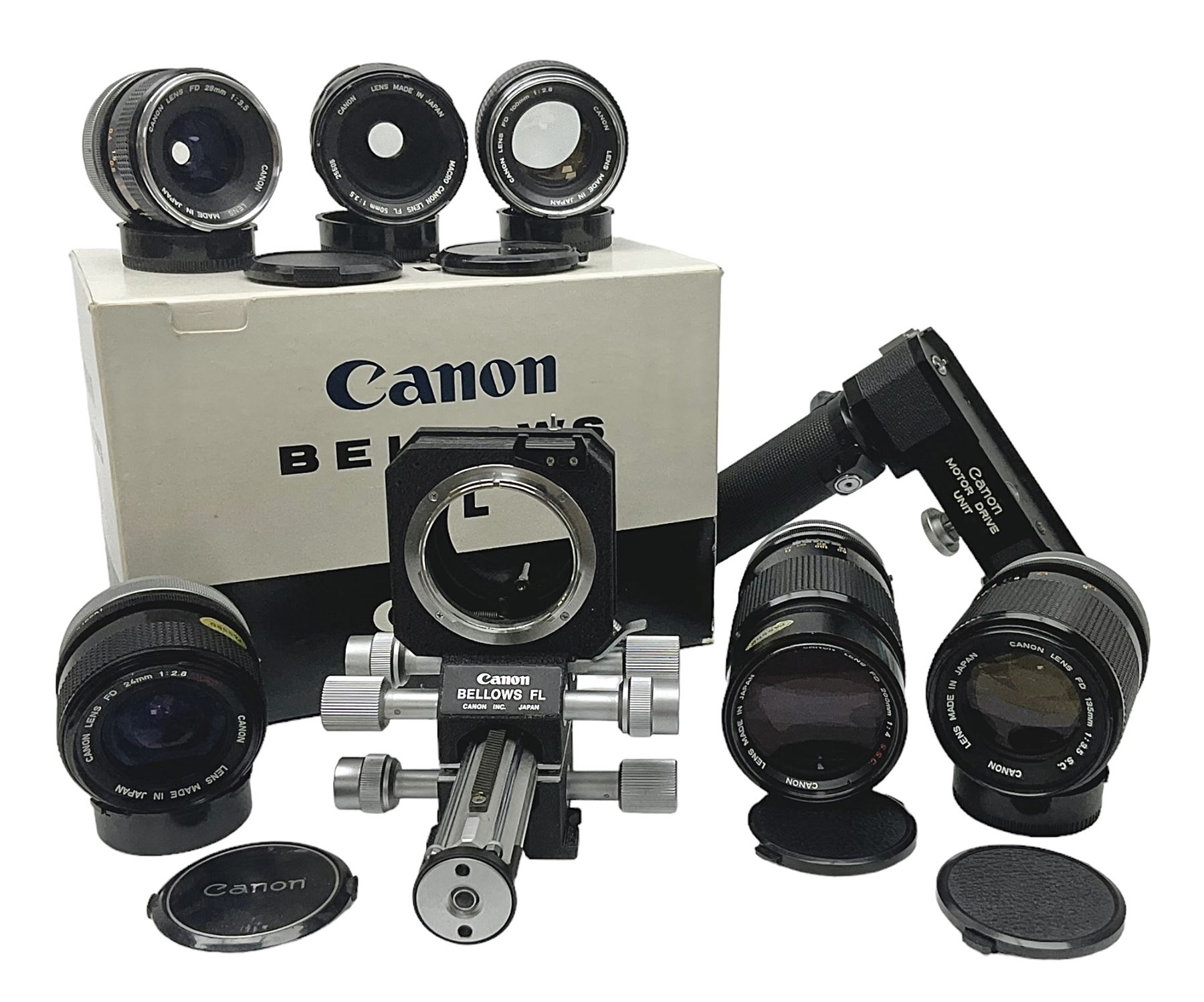 Collection of Canon lenses, to include 'Canon Lens FD 100mm 1:2.8', serial no 12821, 'Canon Lens FD 200mm 1:4' serial no 245313, 'Macro Canon Lens FL 50mm 1:3.5', serial no. 25505, 'Canon Lens FD 135mm 1:3.5 etc, together with other Canon equipment, including Bellows FL, Slide Duplicator etc 