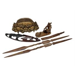 Collection of Carved Zambian items, to include two carved wall hangings, spears etc