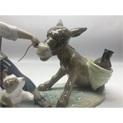 Lladro figure, Boy Pulling Donkey, modelled as a boy with a stubborn donkey, sculpted by Juan Huerta, with original box, no 5178, year issued 1982, year retired 1993, H12cm