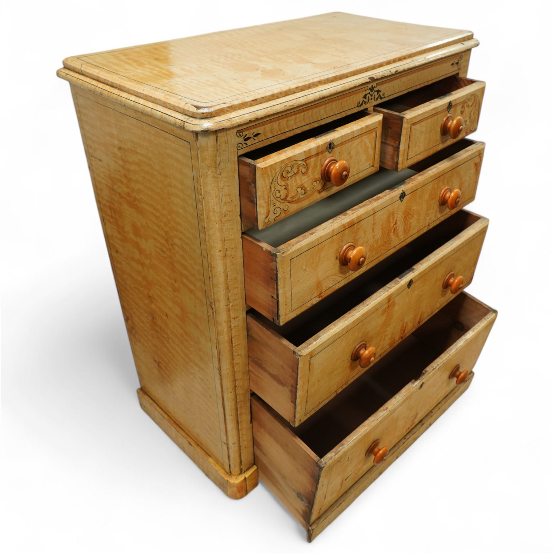 19th century pine painted chest of drawers, rectangular moulded top above two short and three graduated long drawers, each with painted foliate scroll and line detailing, turned knobs, and concealed turned feet, the sides with rounded corners and ebonised detail