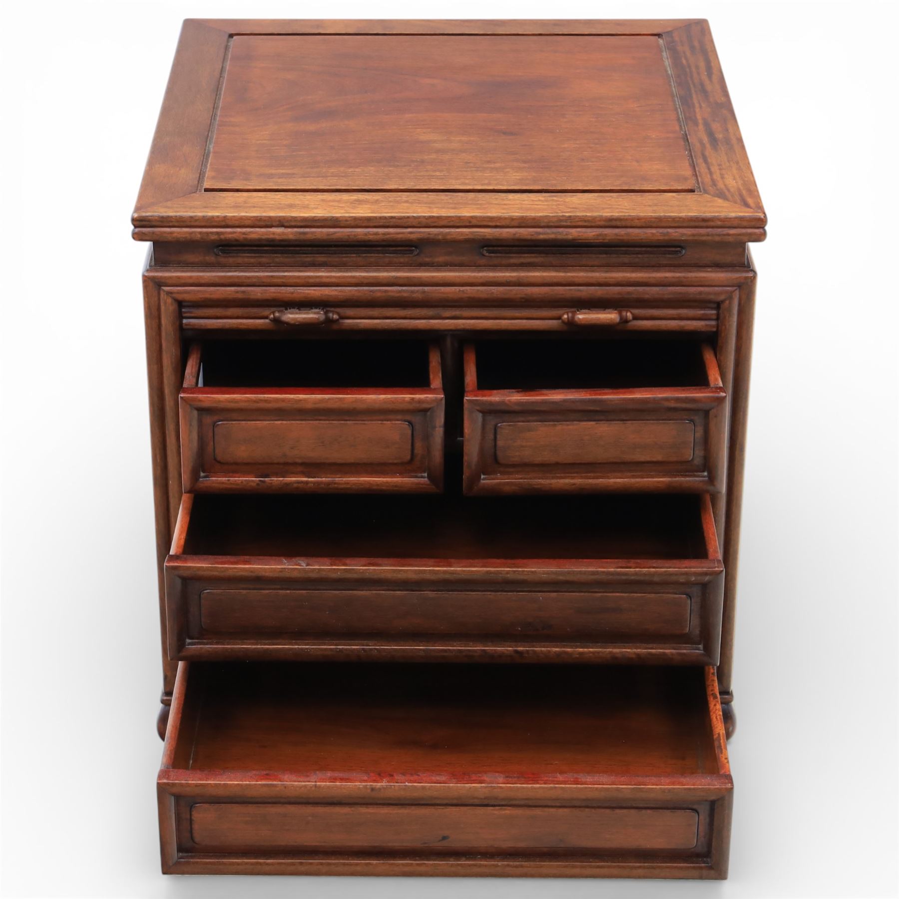 Early 20th century Chinese hardwood filing cabinet, moulded rectangular top over a tambour shutter front with twin recessed handles enclosing an arrangement of graduated drawers, raised on short cabriole legs with shaped apron