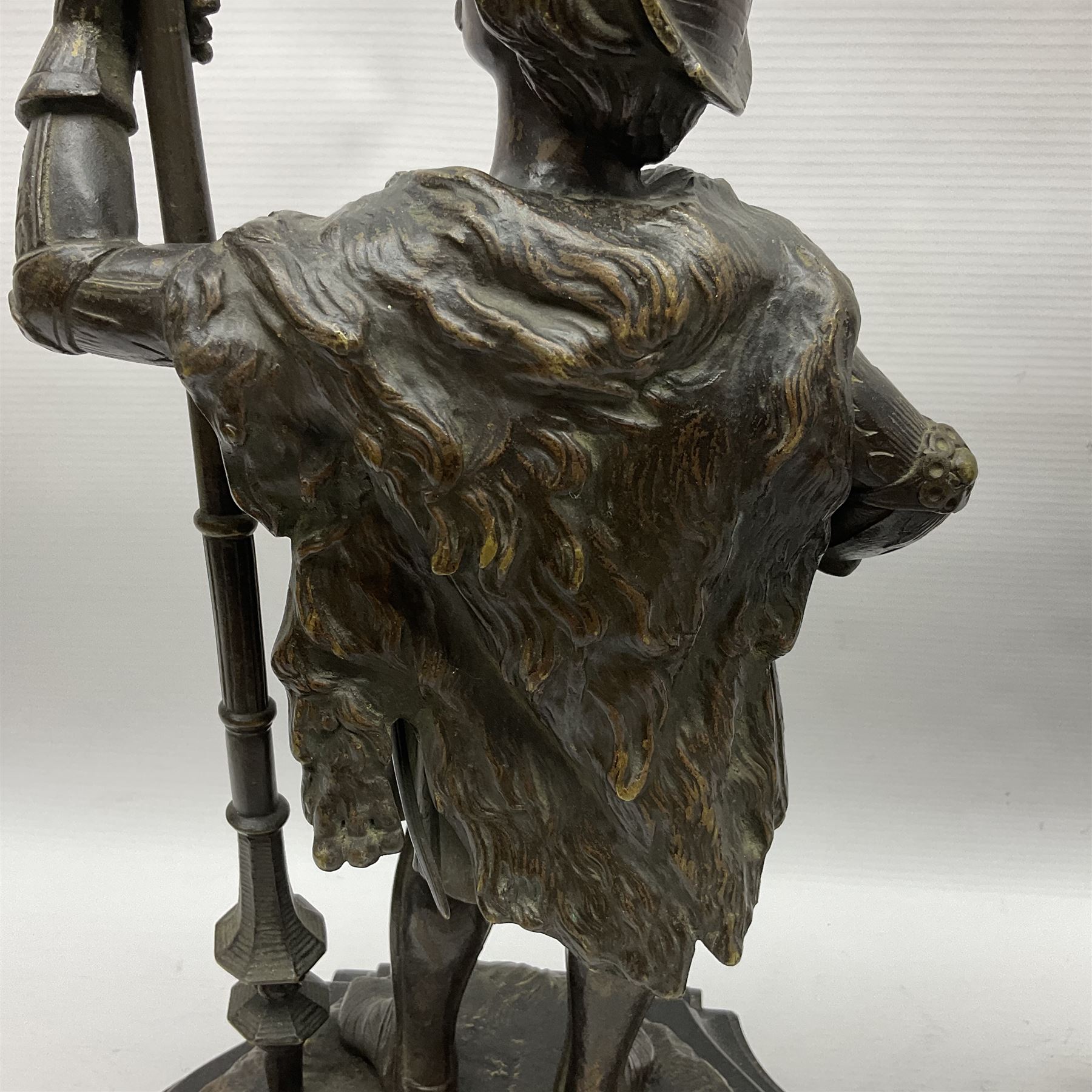 Pair of bronzed figure modelled as a hunter in traditional dress, each holding a pike, H48cm