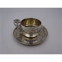French silver cup and saucer, with embossed floral decoration throughout and openwork floral handle, stamped with Minerva's head and maker's mark for 	P. Fres Paris, cup H5.5cm