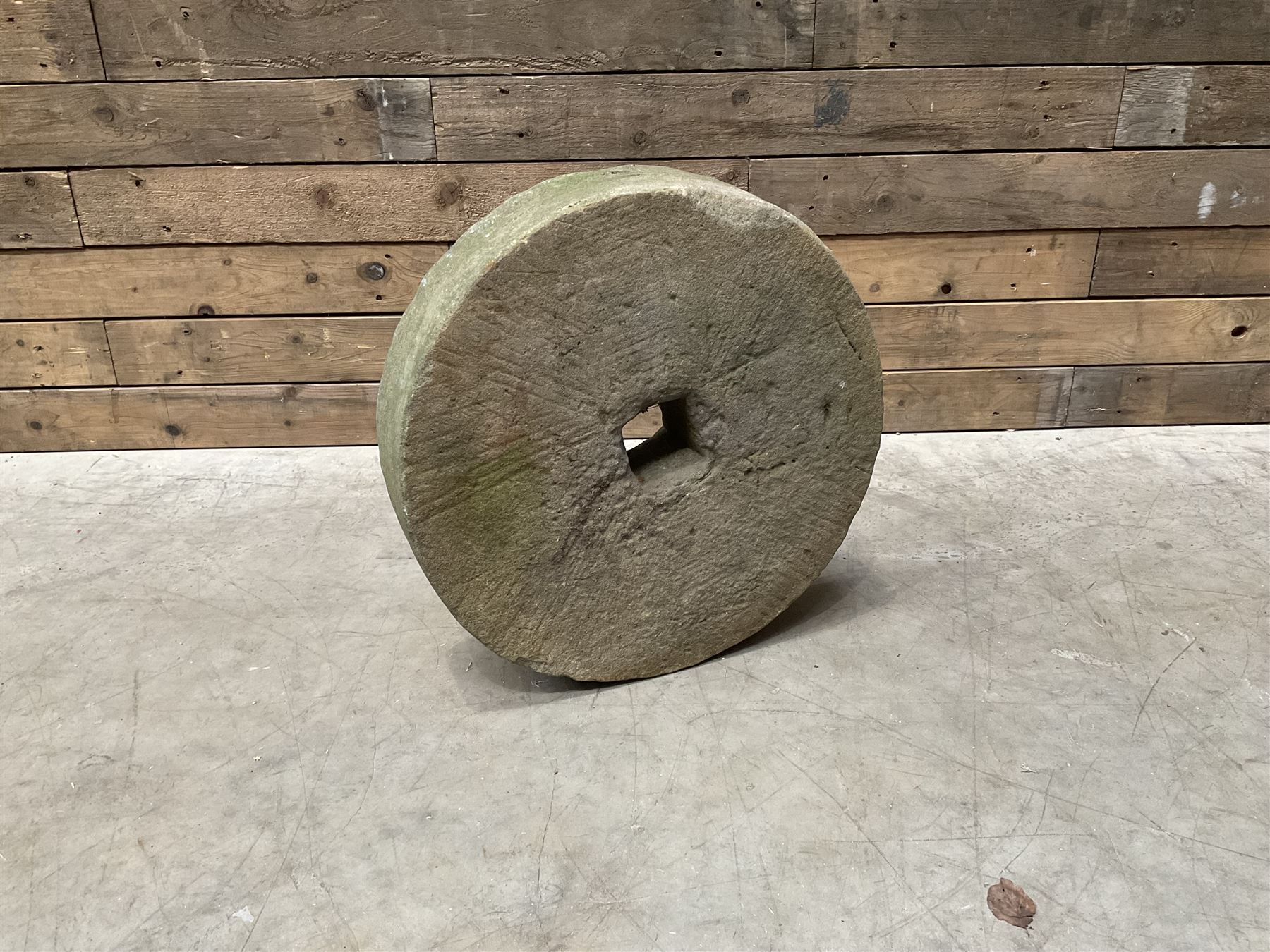 19th century circular stone mill wheel,