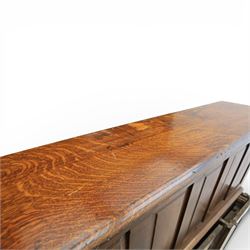 Globe Wernicke - Oak roll top desk, tambour roll top enclosing a fitted interior, raised on two pedestal bases with fitted drawers, raised on a plinth base 