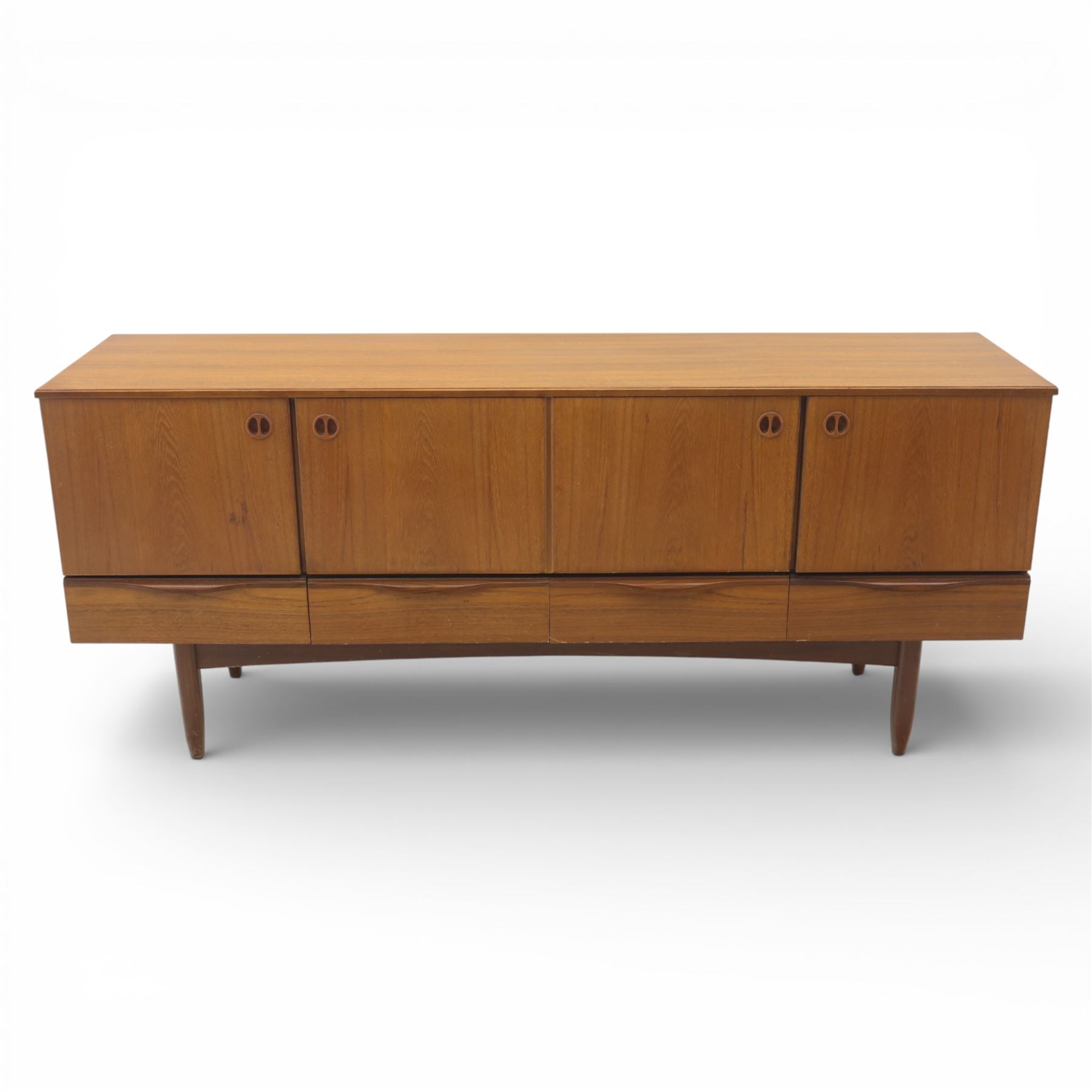 Portwood - Mid 20th century teak sideboard, rectangular top with fall front in the centre flanked by cupboard doors with recessed handles, above four drawers raised on tapered legs