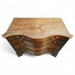 George III Chippendale period mahogany serpentine-fronted chest, shaped top with moulded edge over a deep serpentine outline with four graduated drawers, the canted corners decorated with blind-fretwork geometric decoration, fitted with brass swan-neck handles, lower moulded edge on bracket feet, circa 1760-1770