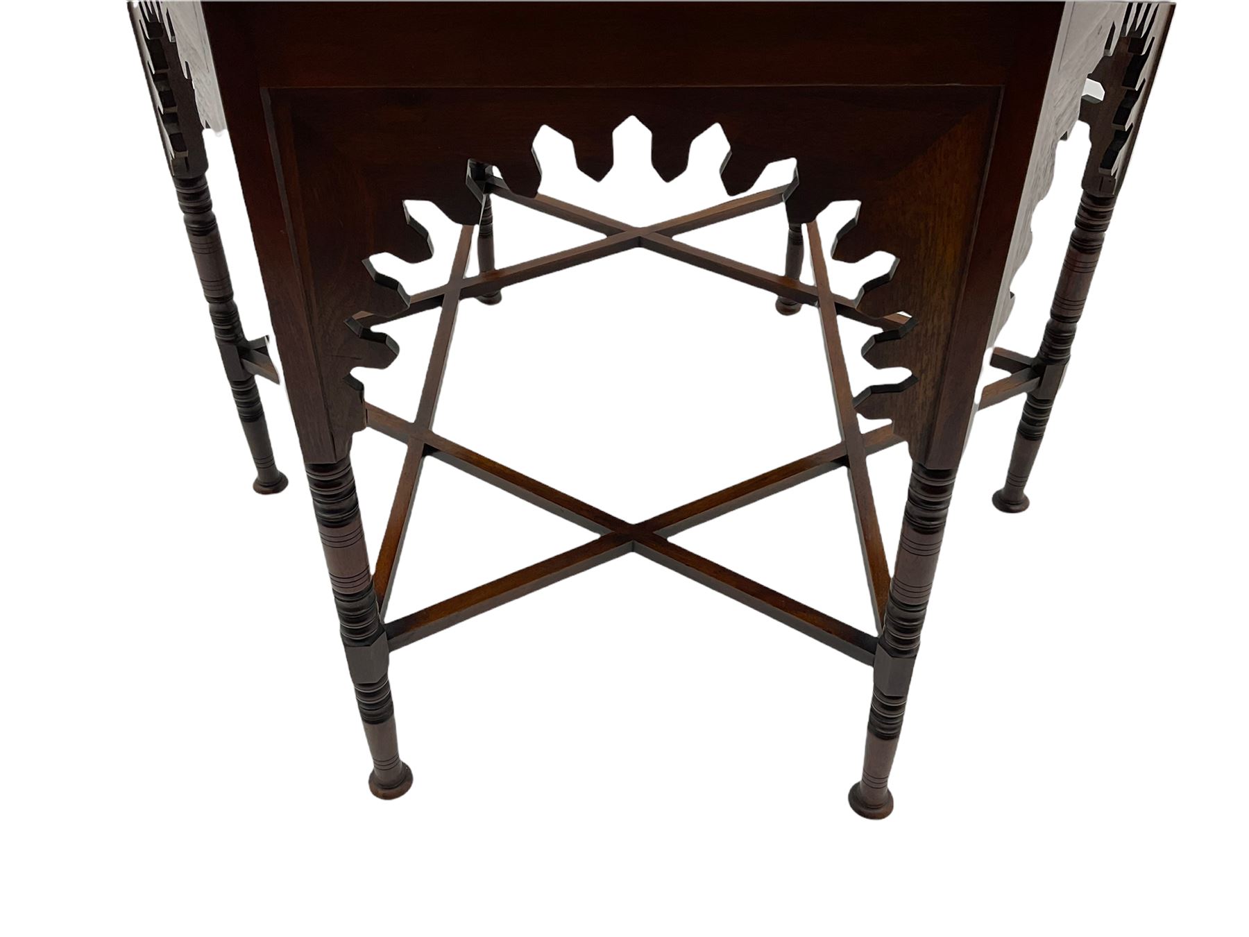 Liberty & Co circa 1890 - walnut centre table, hexagonal form, fretwork frieze, star stretcher base, turned supports on button feet. Stamped on underside.
Featured in - Pictorial Dictionary of British 19th century Furniture Design, Daryl Bennett Liberty's Furniture, 1875-1915, The Birth of Modern Design.
Liberty Style, The Classic Years, 1898 - 1910, by Mervin Levy.