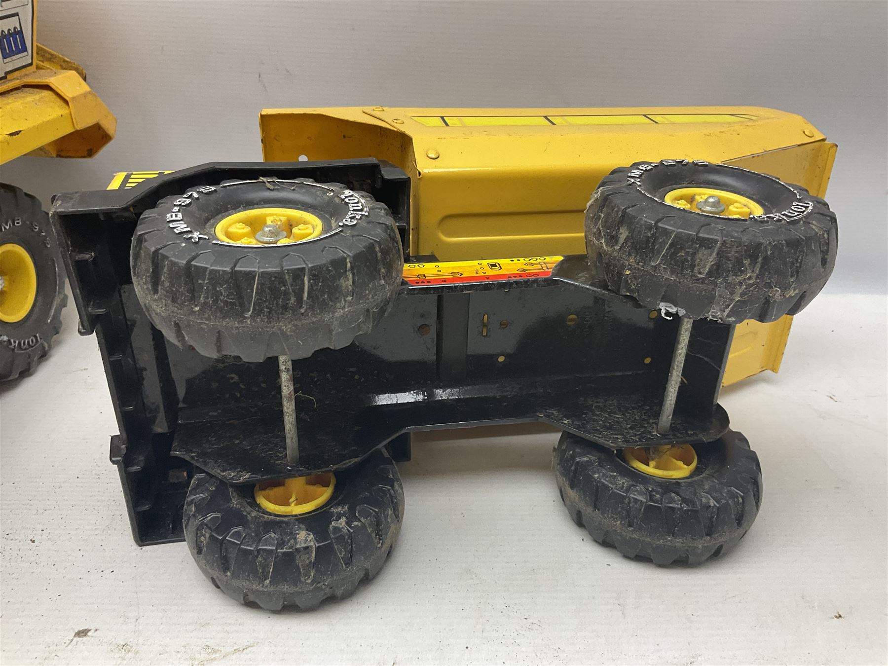Tonka - five large scale pressed steel vehicles comprising Cement Mixer, Mighty Mobile Crane, Jeep and two Dumper Trucks (5)