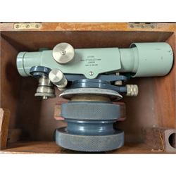 Two theodolites, comprising a Watts example in fitted hard case and a Cooke Troughton and Simms examplie in a wooden case, together with a Stanley dumpy level and a Hall and Watts surveyors measure