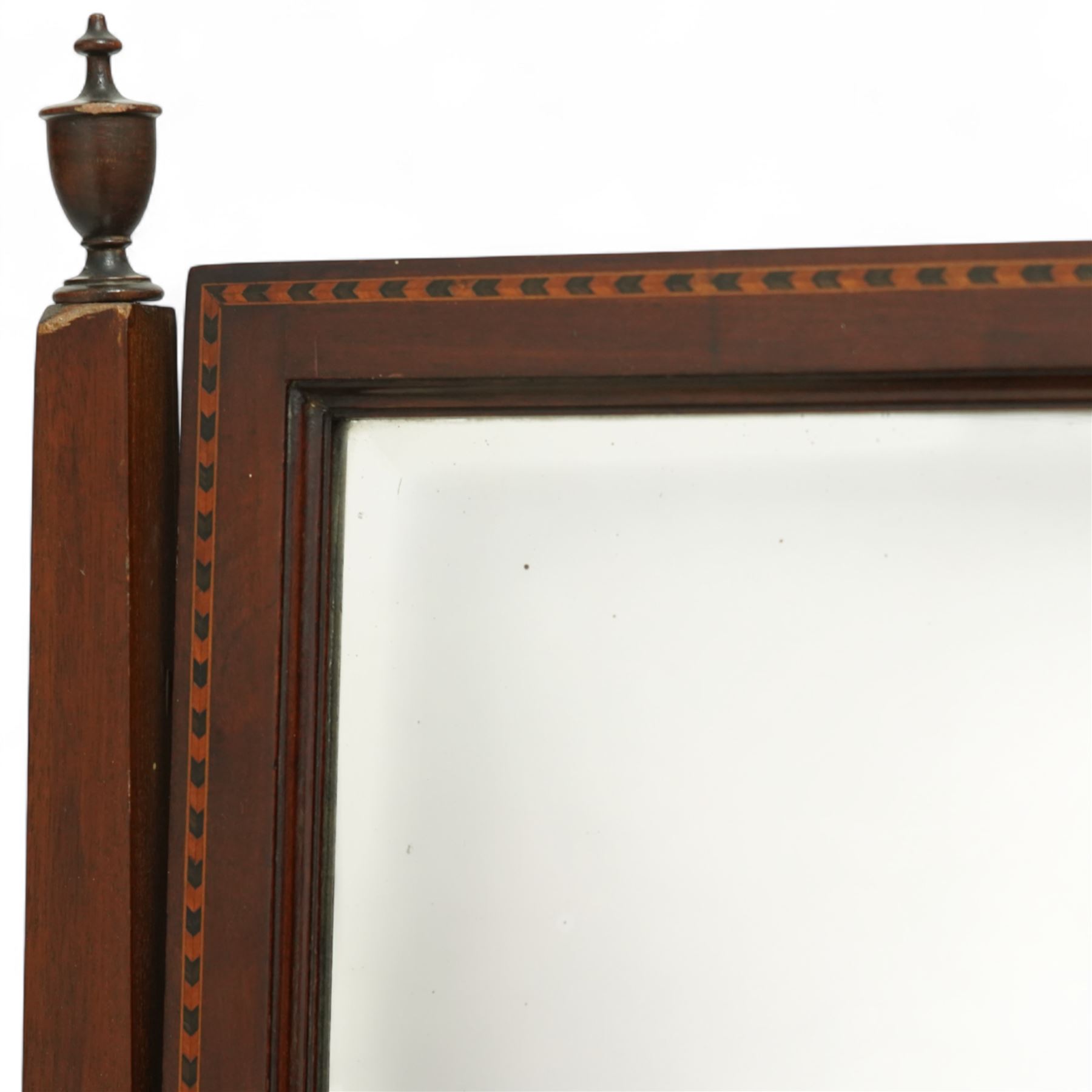Edwardian mahogany herring-bone inlaid dressing chest, with swivel bevelled dressing mirror, supports with finials, and trinket drawer above chest with three graduated drawers on bracket feet