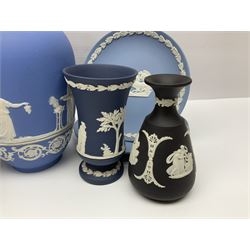 Large collection of Wedgwood Jasperware in dark blue, lilac and light blue, to include mantle clock, lidded boxes, vases, plates etc