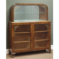  Early 20th century walnut display cabinet, two glass sliding doors enclosing mirrored interior, two glazed doors, ball and claw feet, W98cm, H121cm, D31cm  