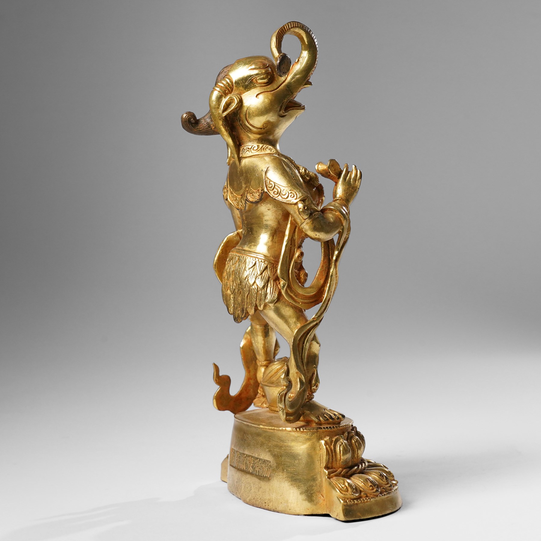 Tibetan gilt bronze figure of Ekadashamukha Avalokiteshvara, standing upright on lotus base, his primary hands in anjali mudra, the other six radiating to the sides, H28cm; together with a gilt bronze figure of Ganesh or Ganapati, H26cm (2)