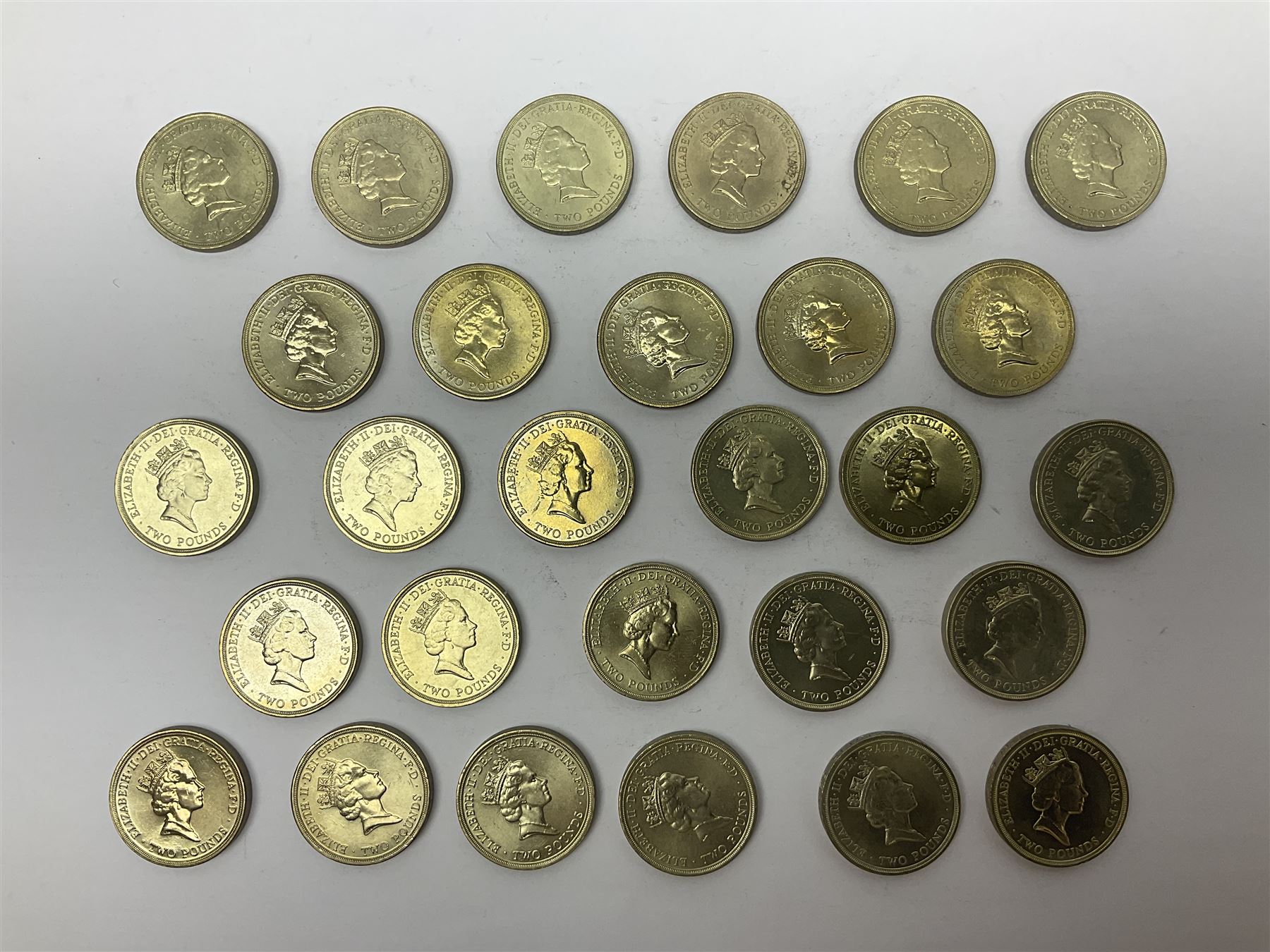 Twenty-eight Queen Elizabeth II old style two pound coins, including 1994 'Bank of England' etc