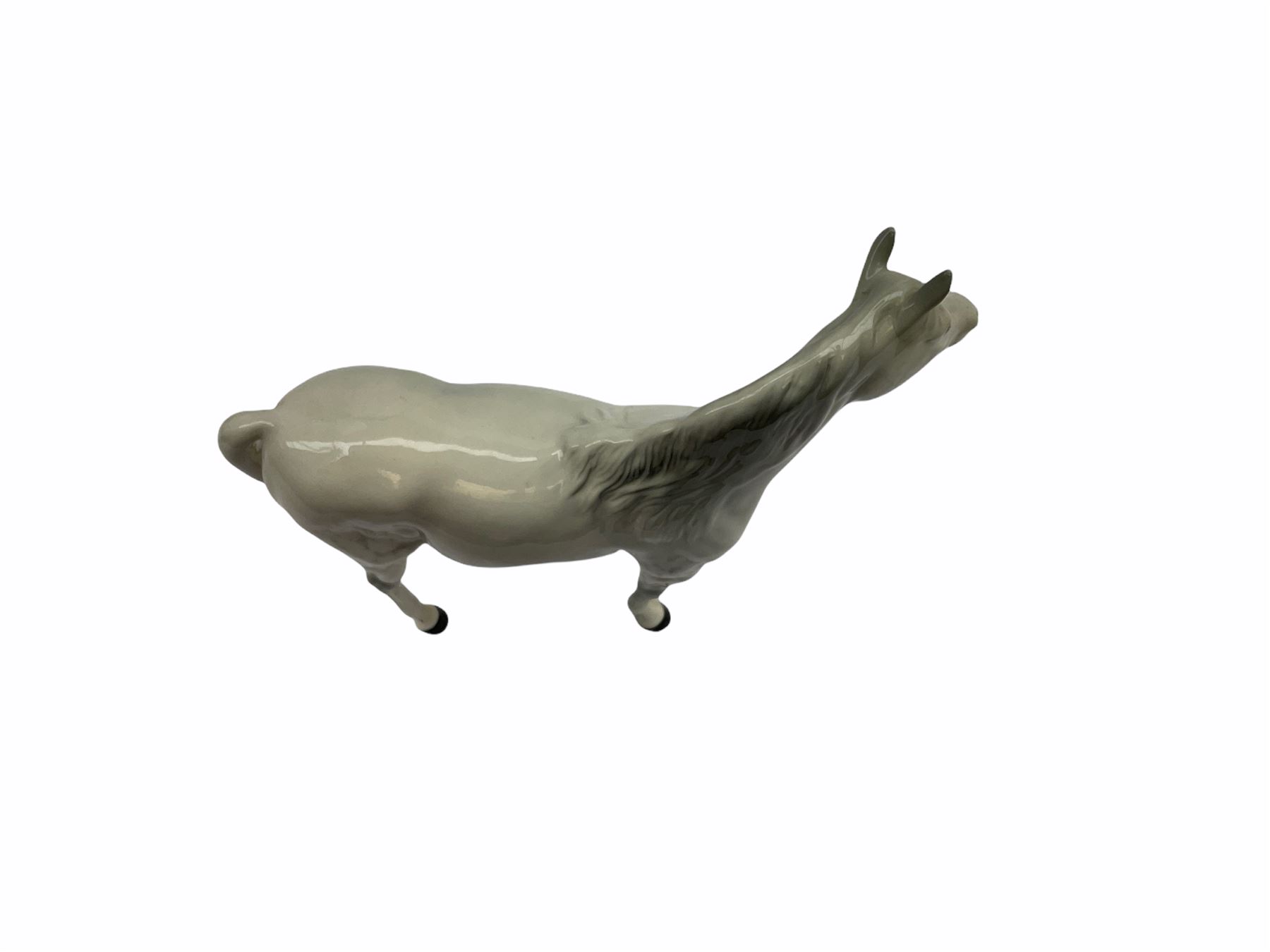 Beswick horse figures, comprising Highland Pony 1644, and another, probably Aran Bahram in grey, each with printed mark beneath.
