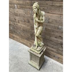 Cast stone garden figure of a bathing lady, raised on square plinth