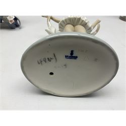 Four Lladro figures, comprising Touch of Class no 5377, Boy Student no 4517, Ocean Beauty no 5785 and Carnival Couple no 4882, largest example H45cm