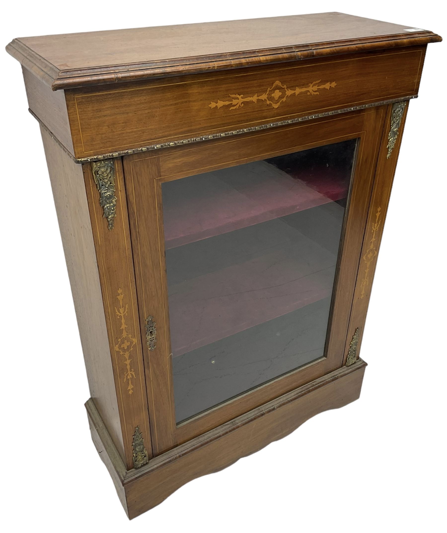 Victorian walnut pier cabinet, moulded rectangular top over inlaid frieze, decorated with gilt metal mounts and beading, the glazed single door flanked by inlaid uprights, on moulded plinth base