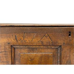 Georgian oak mule chest, moulded rectangular hinged lid over quadruple fielded panel front, the frieze inscribed '17 A Y 57', fitted with two drawers, panelled ends and back, on stile supports