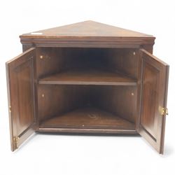 19th century painted oak corner cupboard, decorated with floral motifs, brass locking handle