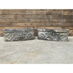 Pair of weathered cast stone ornate rectangular planters, canted corners, lion mask detail