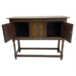 17th century style caved oak side cabinet, fitted with two cupboards, stretcher base