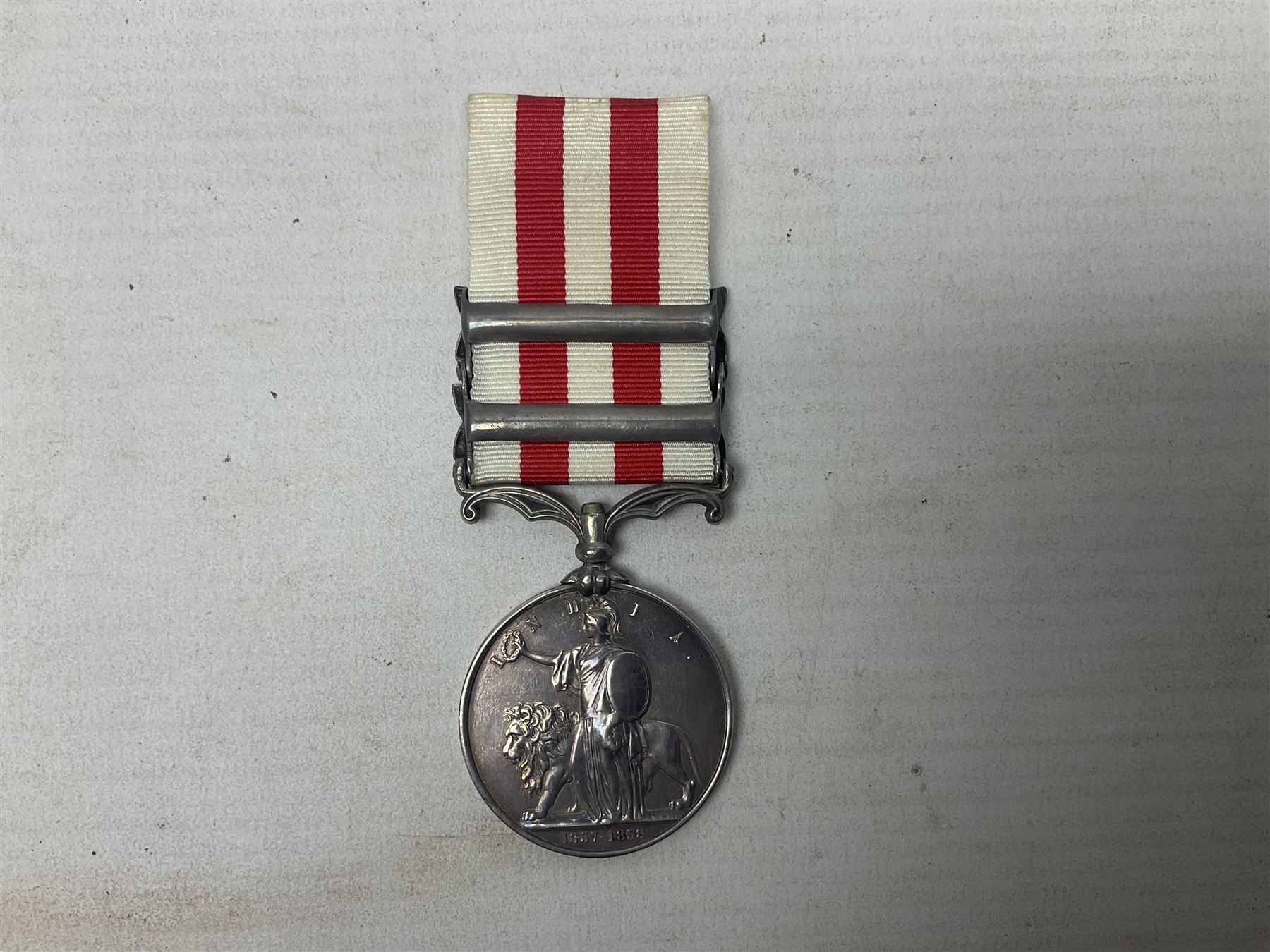 Victoria Indian Mutiny Medal with two clasps for Lucknow and Defence of Lucknow awarded to J. French 1st Batn. 5th Fusrs., with ribbon; some biographical details