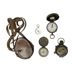 Early 20th century Verner's Service pattern type brass military compass, together with three further brass cased compasses and a leather case embossed R. Strafford 1917