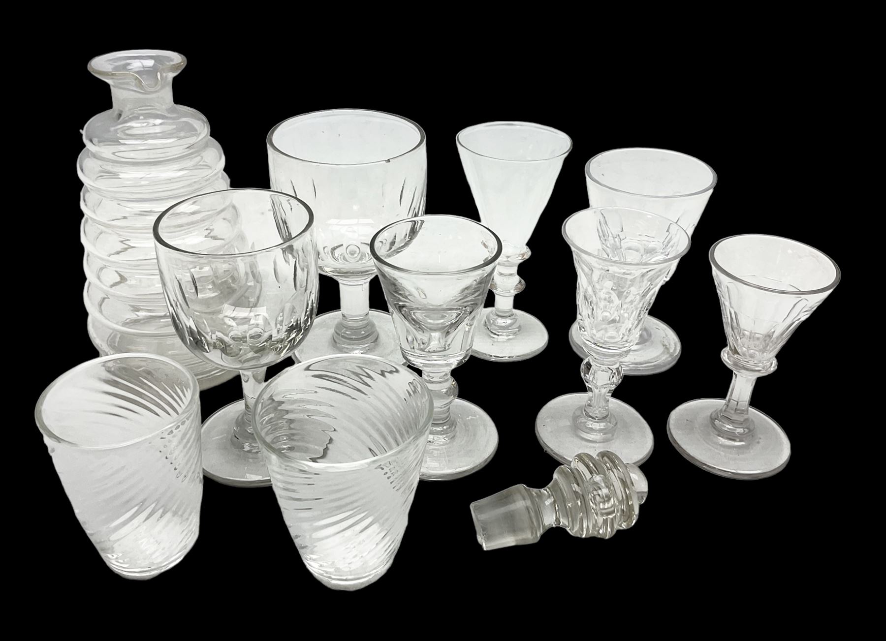 Quantity of Georgian and Victorian glasses, comprising late 19th century Beehive decanter, two thumb print rummer glasses, two 1780s Bristol glass of wrythen form, early Victorian toastmasters glass, two late Georgian wine glasses, late 18th century petal moulded wine glass, and early 19th century facet cut small wine glass