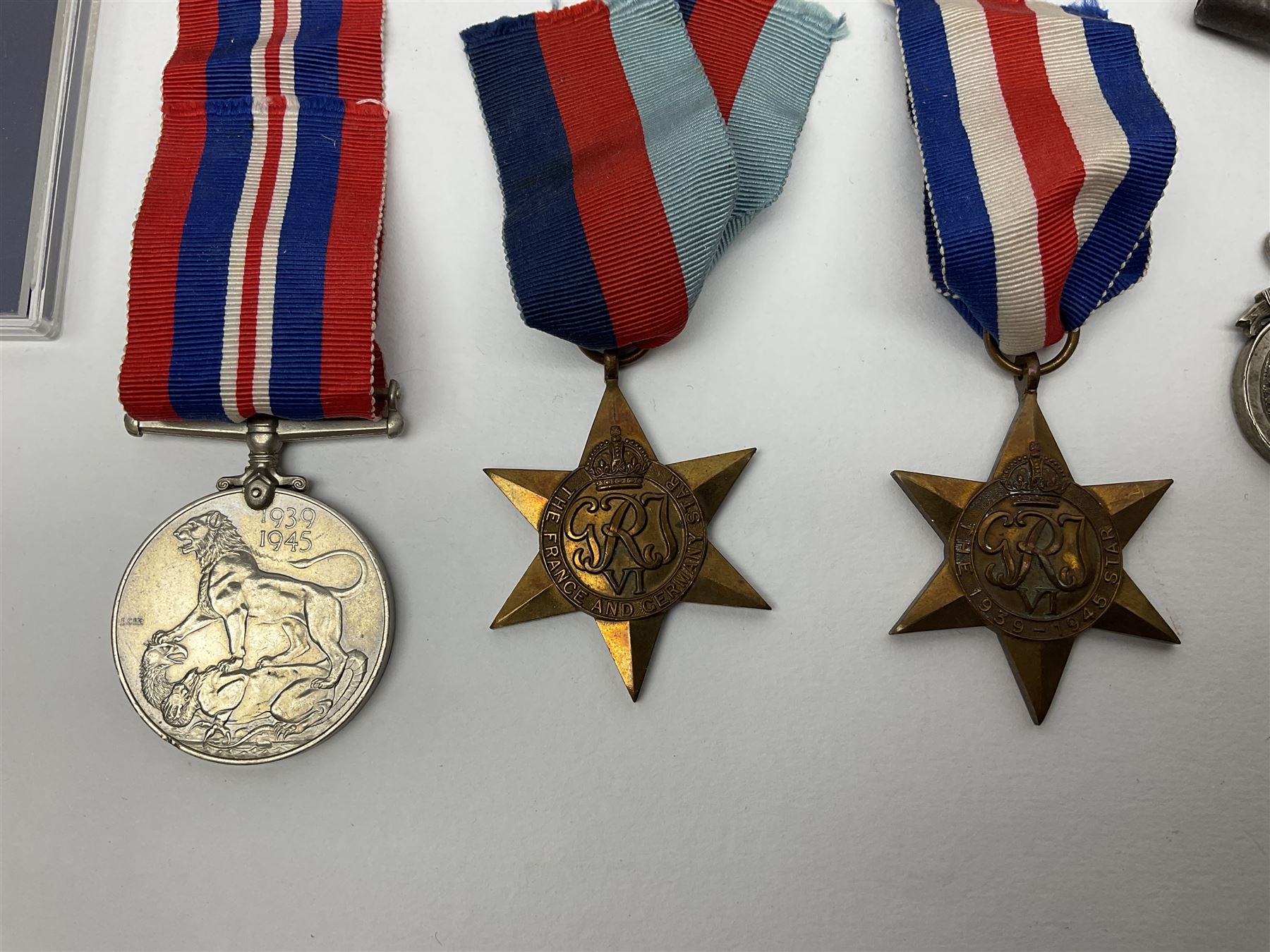 WW2 group of three medals comprising 1939-1945 War Medal, France & Germany Star and 1939-1945 Star; all with ribbons; 1930s Hull Savings Bank silver and enamel presentation fob; three medallions depicting Hitler, Mussolini and Mao Tse Tung; quantity of modern crowns and other coins; and a 6mm Flobert style starting pistol