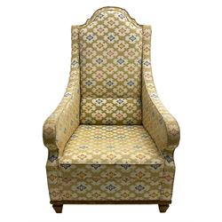 Spanish high back throne armchair, arched cresting rail over scooped arms, upholstered in gold and ivory patterned fabric, on a pitch pine base with spade feet
