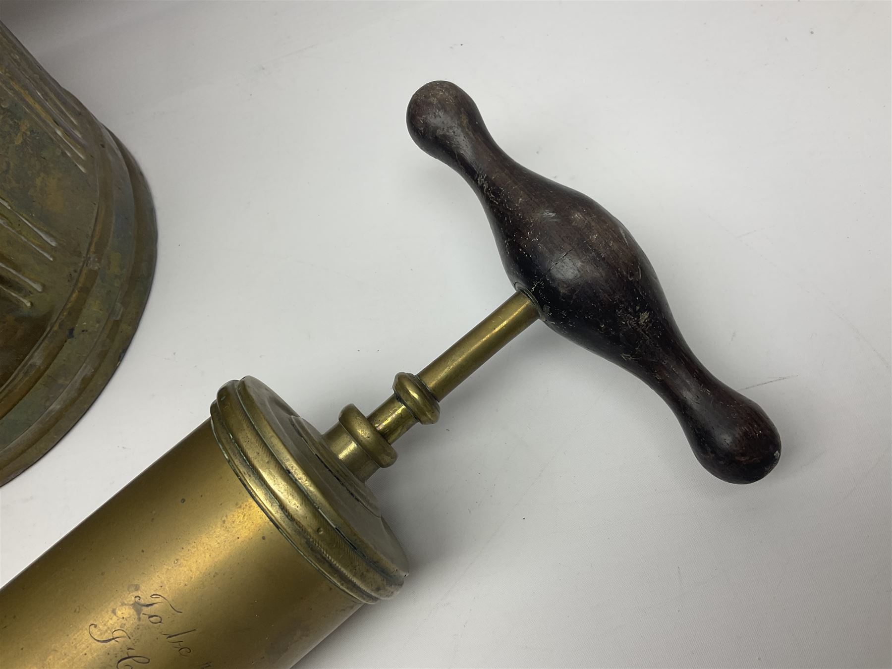 Victorian brass veterinary syringe, with wooden handle, inscribed 'to be returned to J.Cooke FRCV Scarboro' together with a brass jam pan, coal scuttle and spoon and four pewter tankards